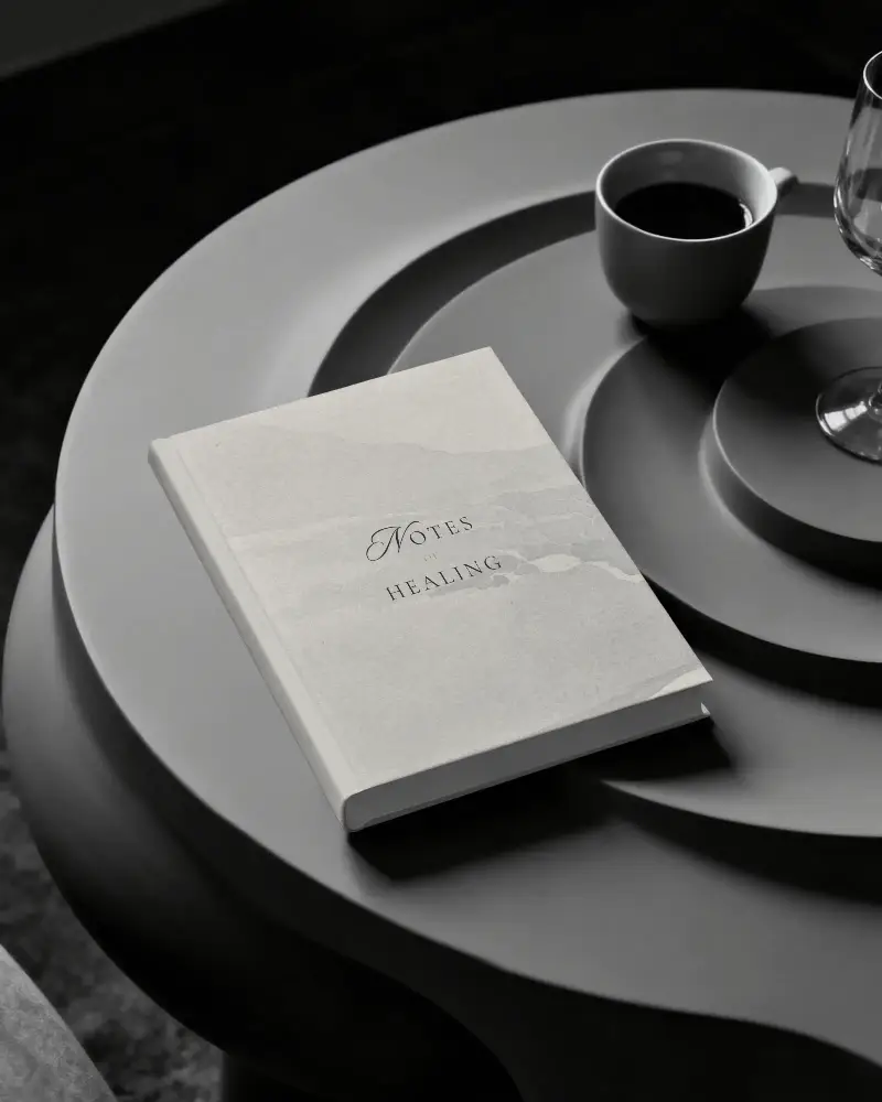 Minimalistic Modern Book Mockup On Geometric Tabletop With Coffee Cup And Glassware