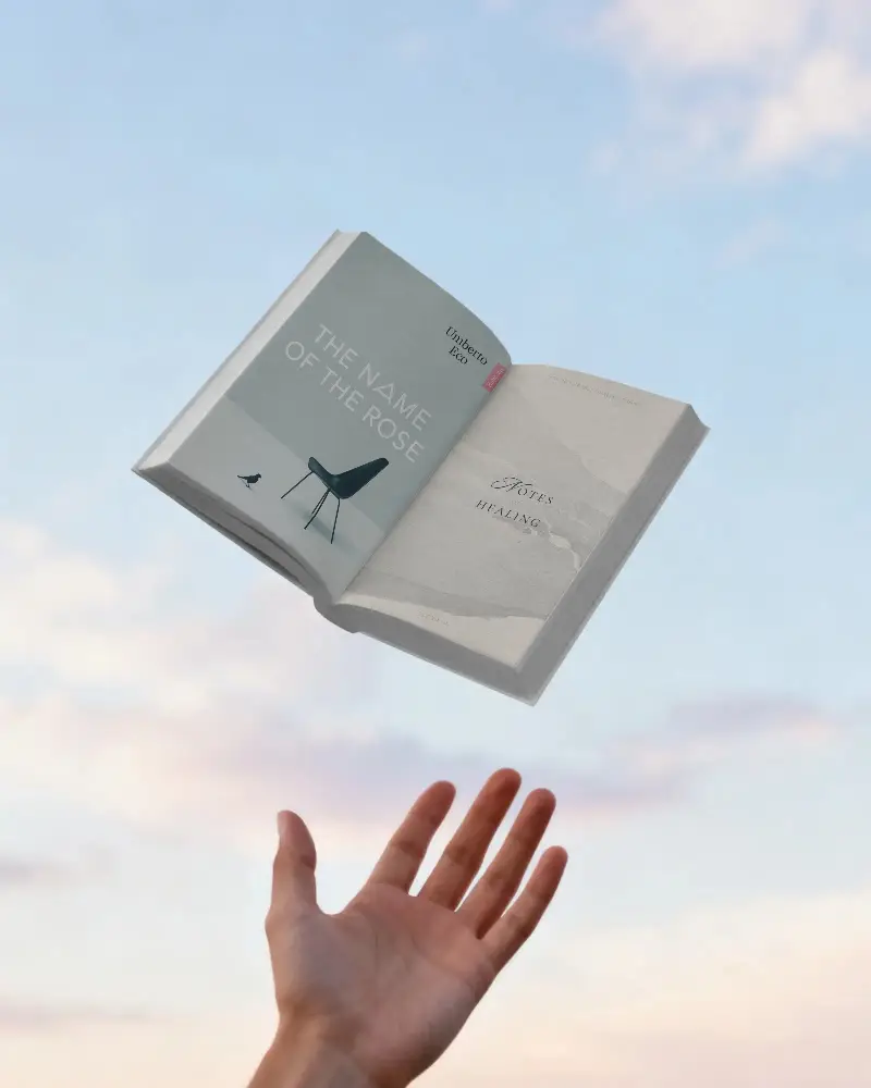 Minimalist Open Book Mockup Showing Empty Pages In Flying Motion Outdoor