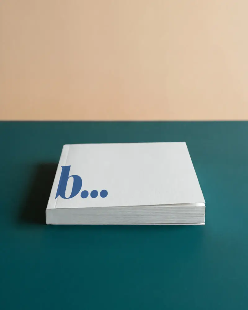 Hardcover Book Mockup With Simple Plain Cover Lying Flat On Colorful Background