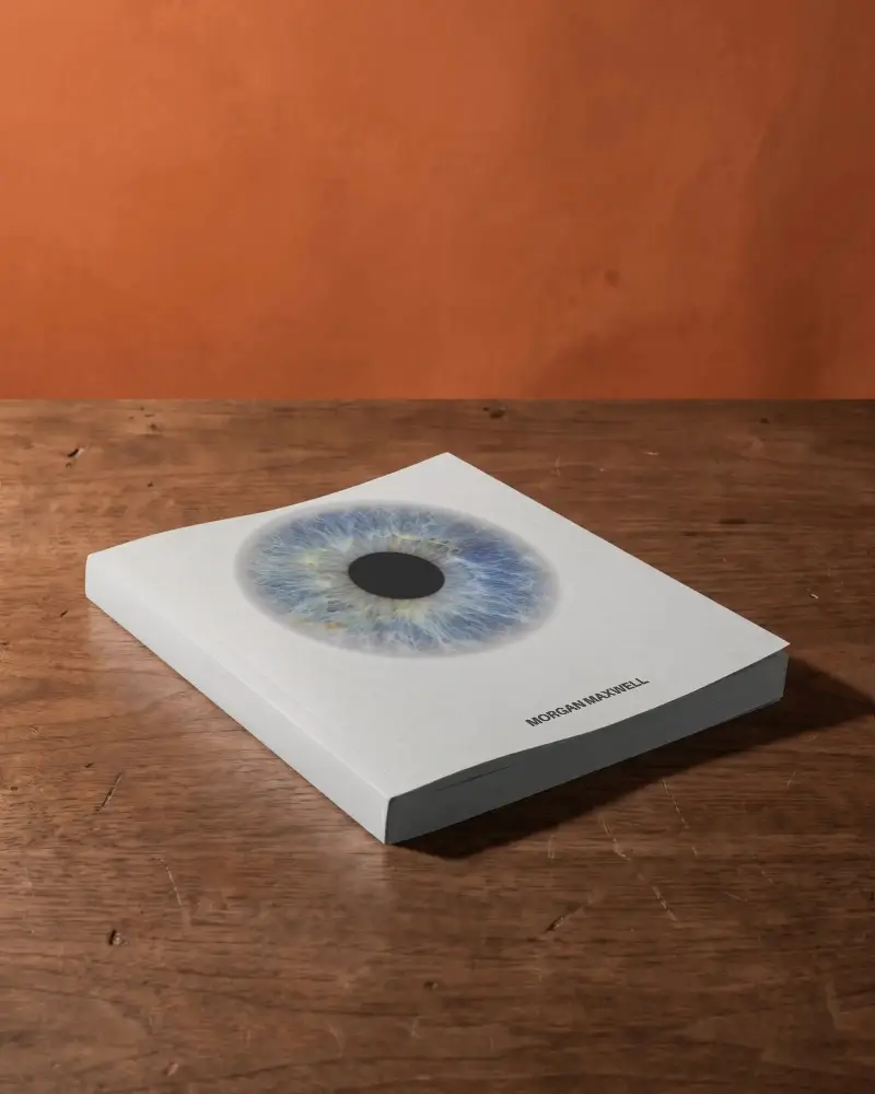 Closed Softcover Book Mockup On Textured Wooden Tabletop With Minimalist Studio Background