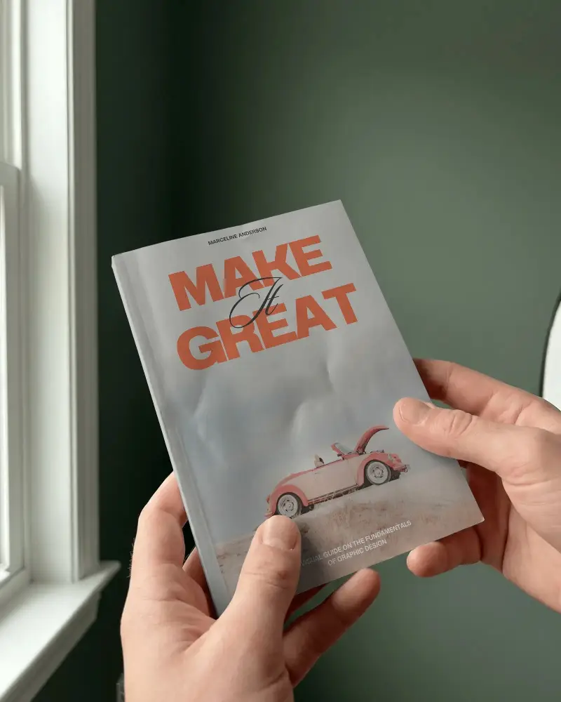 Hands Holding Crumpled Softcover Book Mockup With Blank Cover For Design Presentation