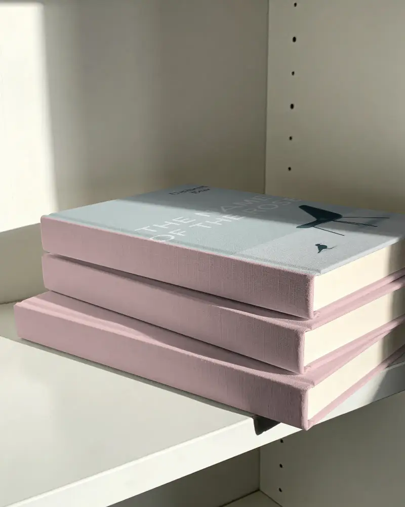 Stack Of Hardcover Book Mockups On White Shelf For Minimal Design Presentations