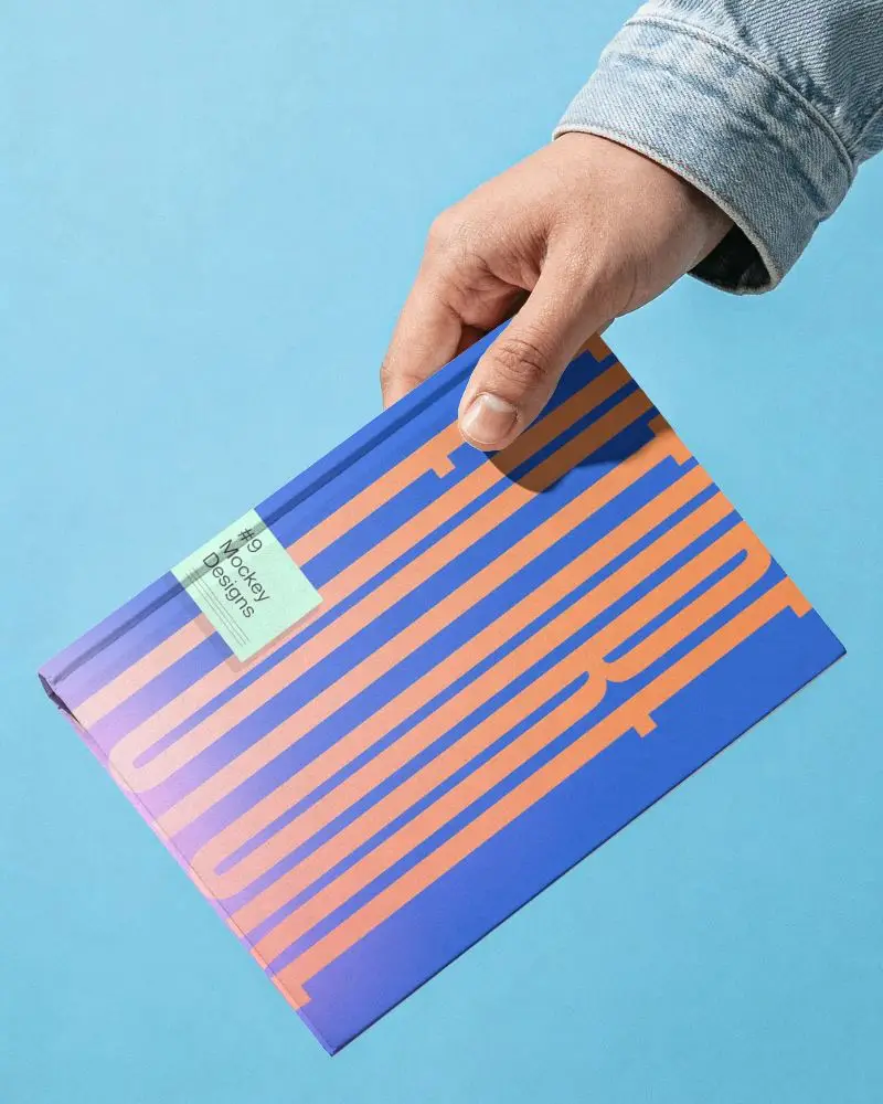 Hand Holding Hardcover Book Mockup For Modern Print Design And Branding Presentation