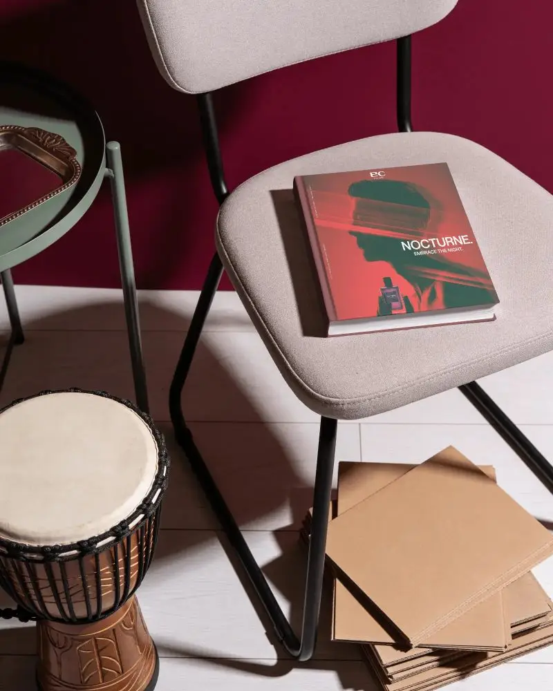 Minimalistic Hardcover Book Mockup On Chair With Modern Interior Background