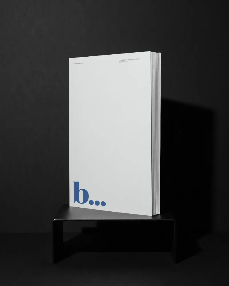 Blank Book Mockup On Modern Stand With Dark Background For Design Showcase