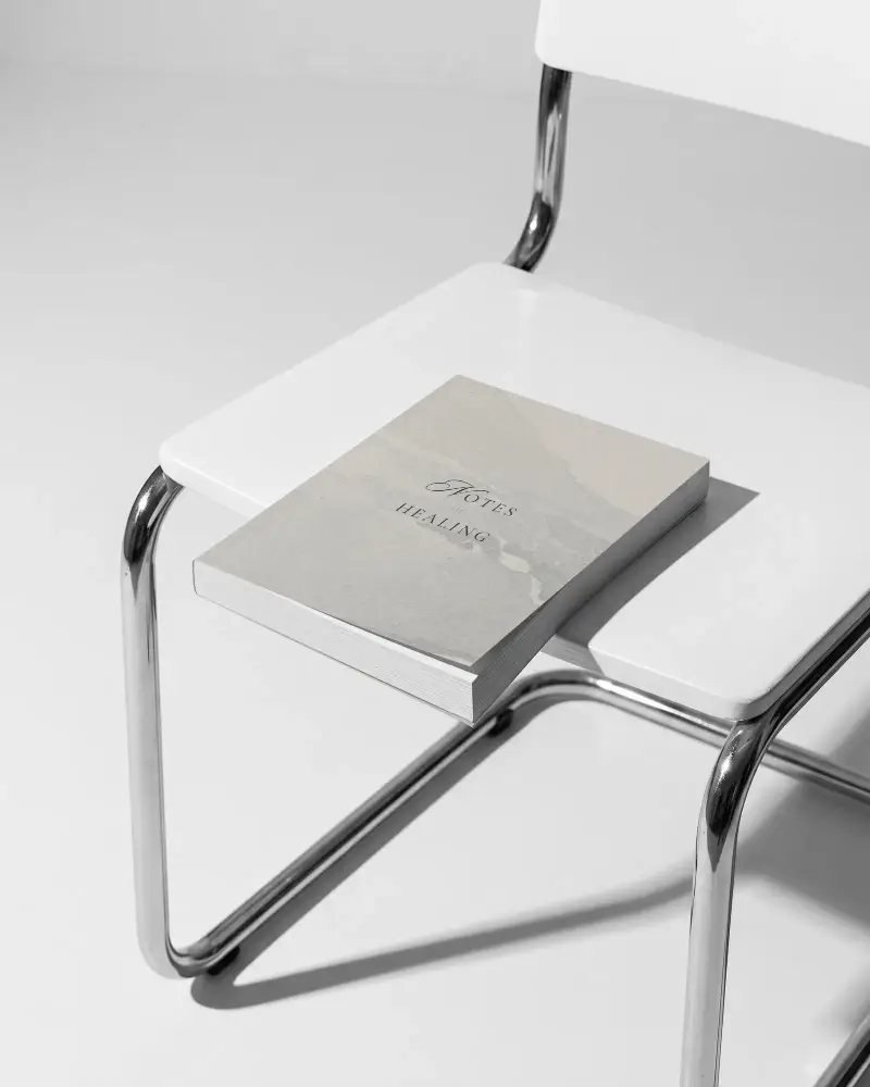 Modern Minimalist Book Mockup On Contemporary Chair For Clean Design Presentation