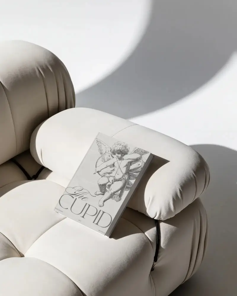 Minimalistic Hardcover Book Mockup On Modern Upholstered Chair With Soft Shadows Background
