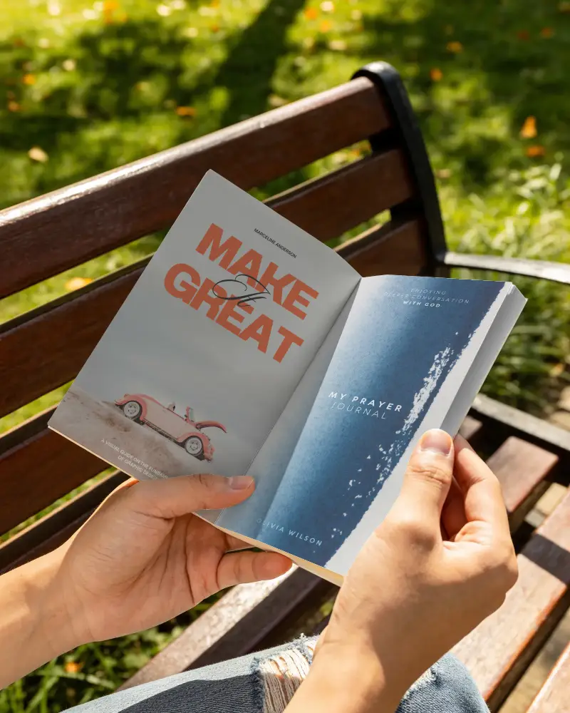 Open Book Mockup In Hands With Blank Pages On Wooden Bench Outdoor Background