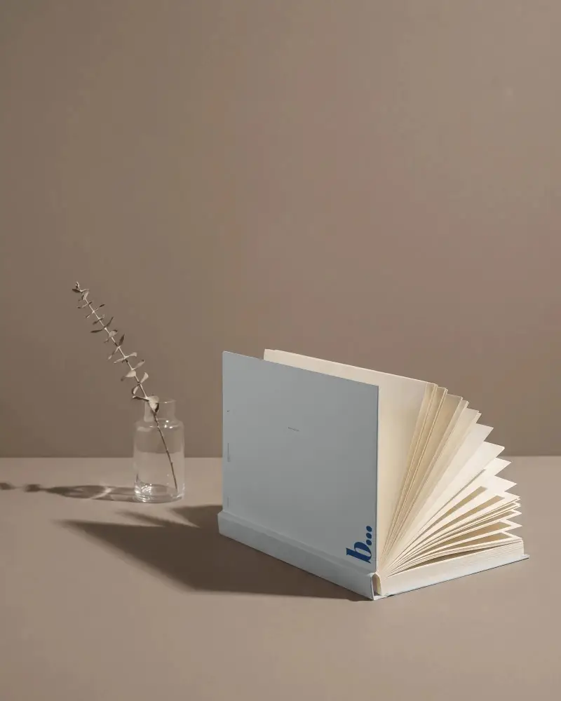 Stylish Minimalist Open Book Mockup With Vintage Plant In Glass Jar Timeless Design
