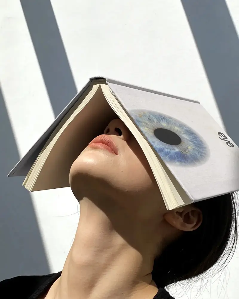 Creative Book Mockup With Person Showing Reading Emotion And Unique Visual Concept Design