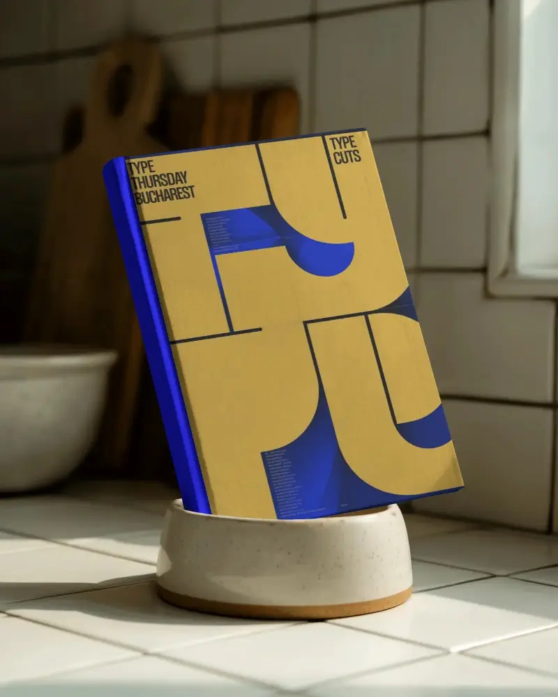 Blank Standing Book Mockup Placed In Ceramic Bowl On Kitchen Countertop Natural Lighting Shadows