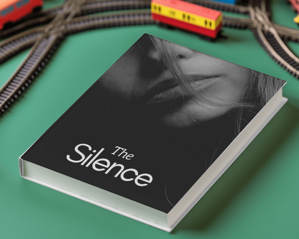 Glossy Book Cover Mockup Hardcover Placed On Green Surface With Toy Train In Background Playful And Vibrant Theme