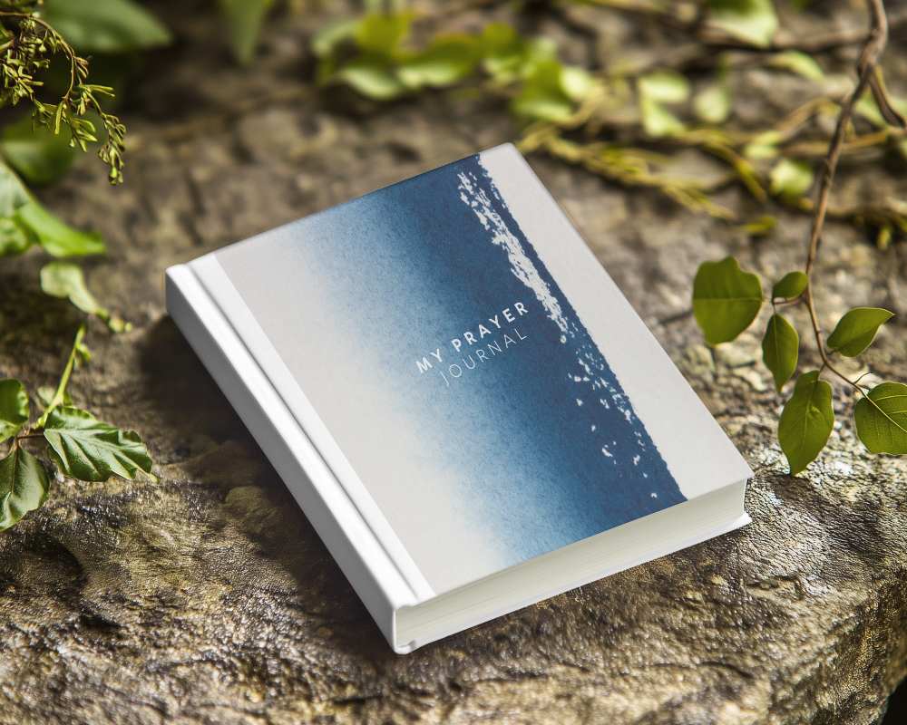 Nature Inspired Hardcover Book Mockup On Textured Stone Surface Surrounded By Greenery Organic And Earthy Aesthetic 0233