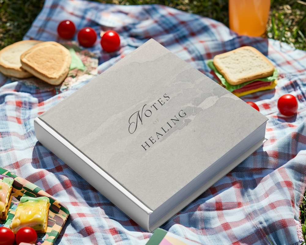 Outdoor Hardcover Book Mockup On Textured Stone With Greenery Natural And Organic Setting 0234