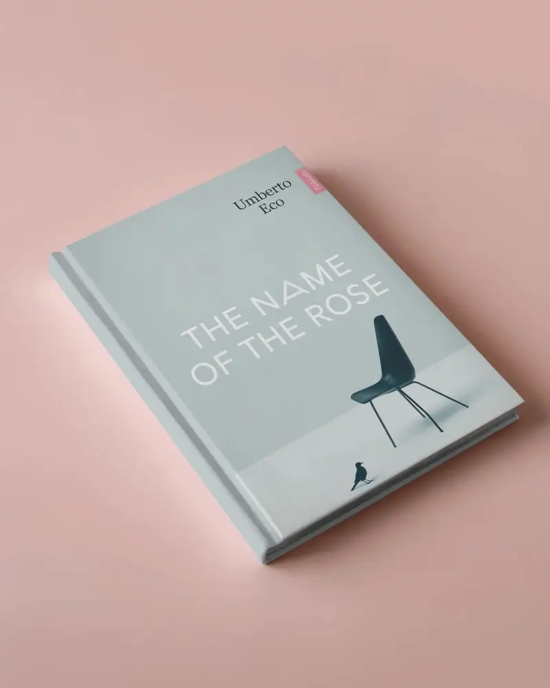 Angled Top View A4 Book Mockup Hardcover Glossy Finish On Soft Pink Background With Clean Minimal Lighting