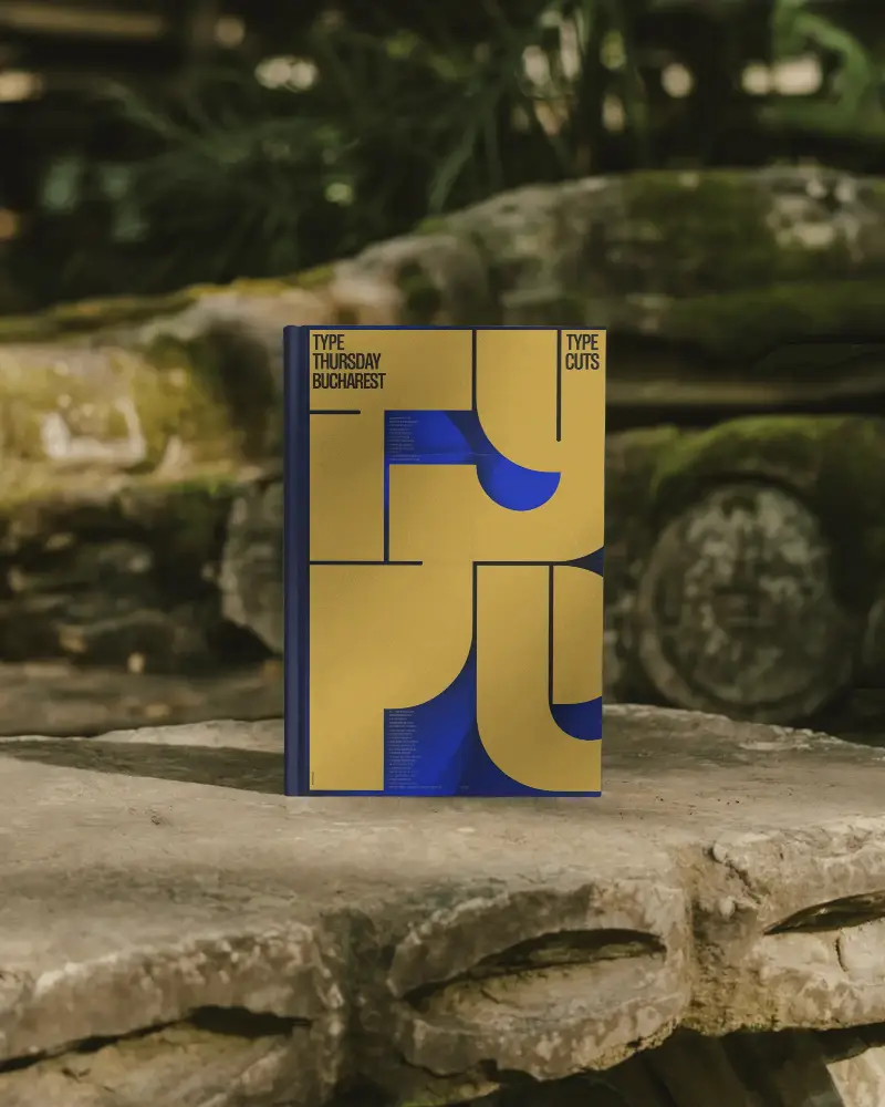 Hardcover Book Mockup On Weathered Stone Surface In Lush Natural Outdoor Setting