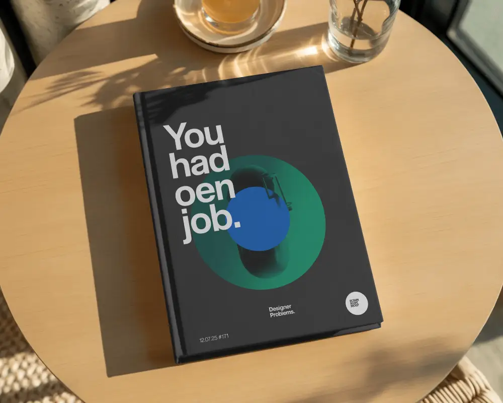 Hardcover Book Mockup Flat On Round Wooden Table With Sunlight And Tea Glass