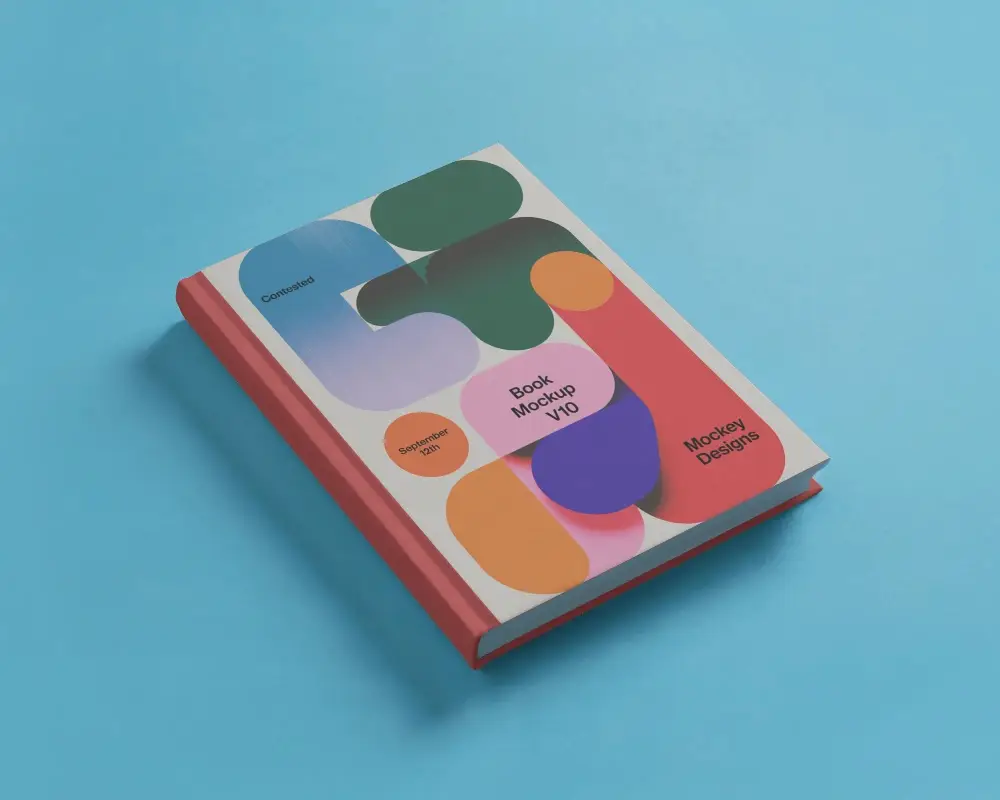 Angled Book Mockup On Flat Blue Surface With Clean Studio Light And Minimal Shadows