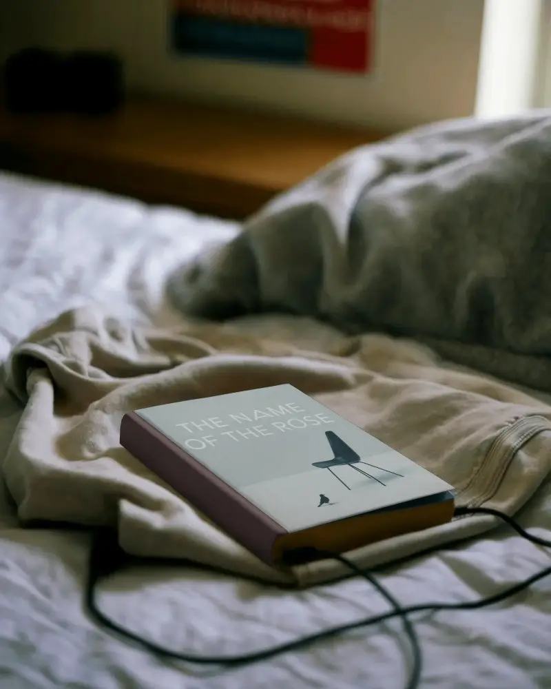 Book Mockup On Soft Cloth Bedspread With Minimalist Hardcover For Branding Display