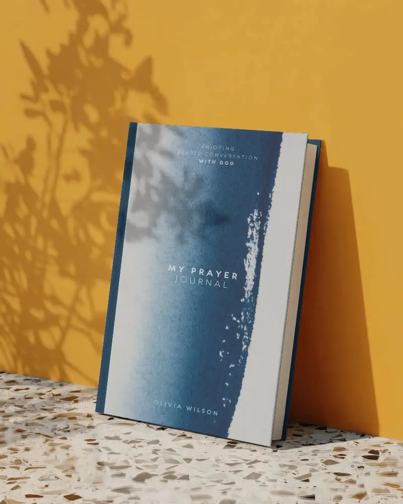 sunlit-book-mockup-leaning-on-yellow-wall-with-shadow-play-and-terrazzo-floor-detail