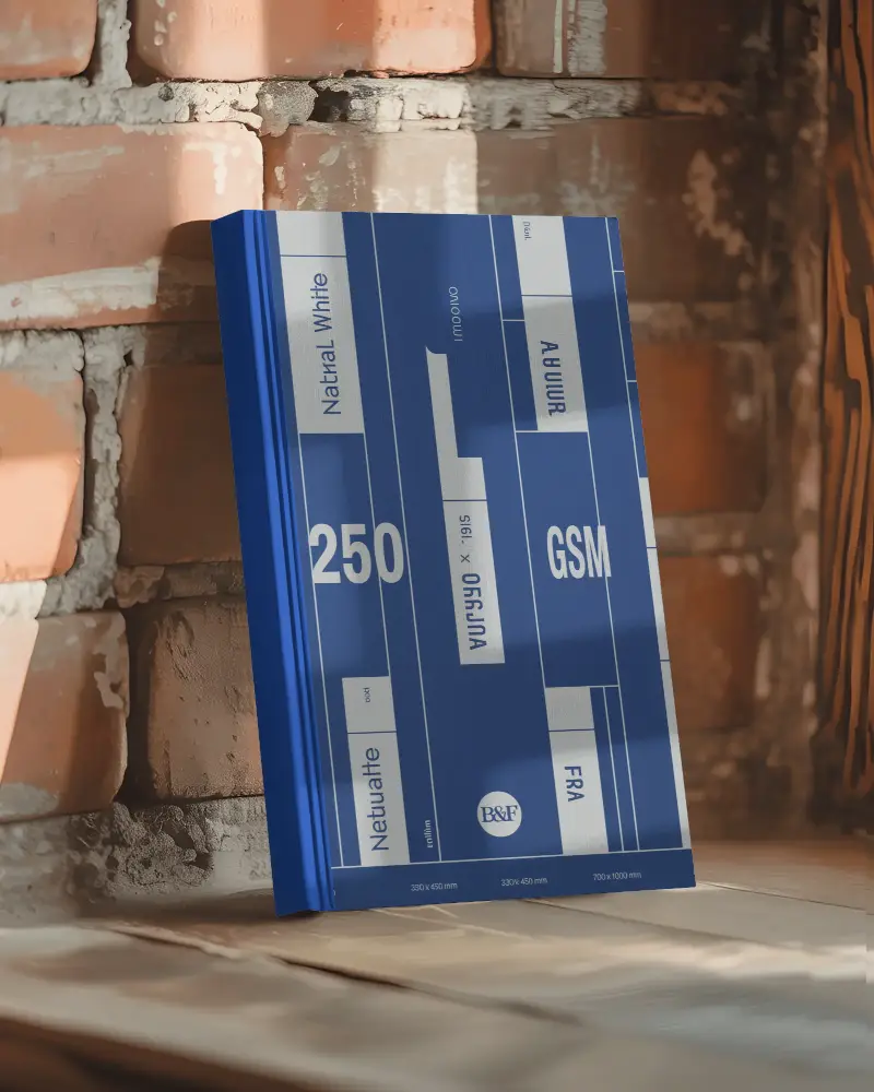 hardcover-book-mockup-standing-on-wooden-surface-against-textured-brick-wall-background