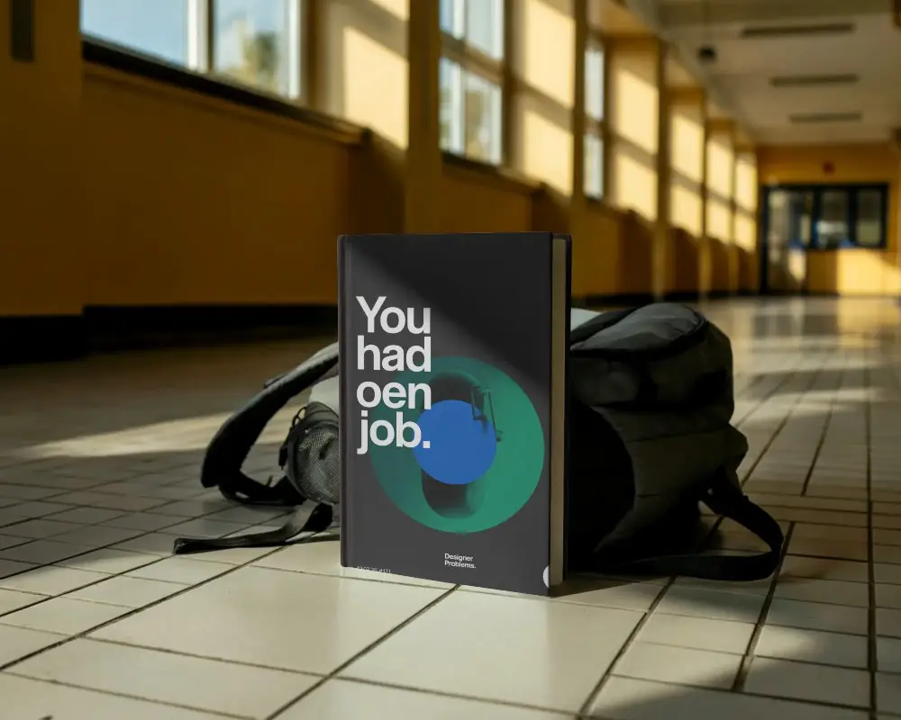 book-mockup-placed-against-backpack-in-corridor-with-sunlight-pattern-educational-environment