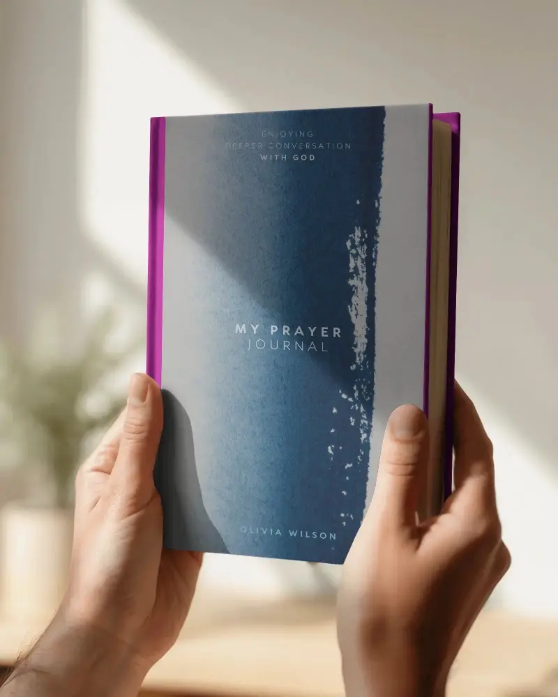 hands-holding-closed-hardcover-book-mockup-with-blank-cover-space-for-custom-design