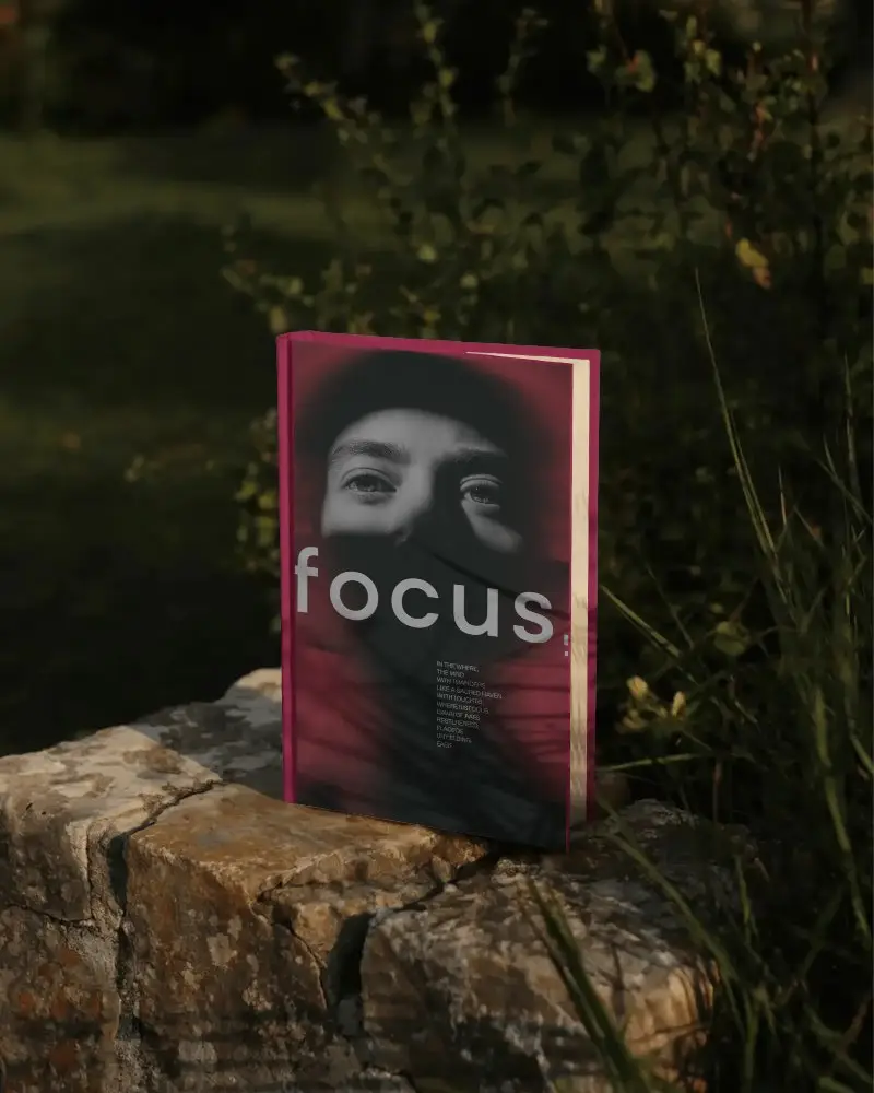 hardcover-book-mockup-with-shadow-outdoor-setting-on-rough-stone-surface-natural-light