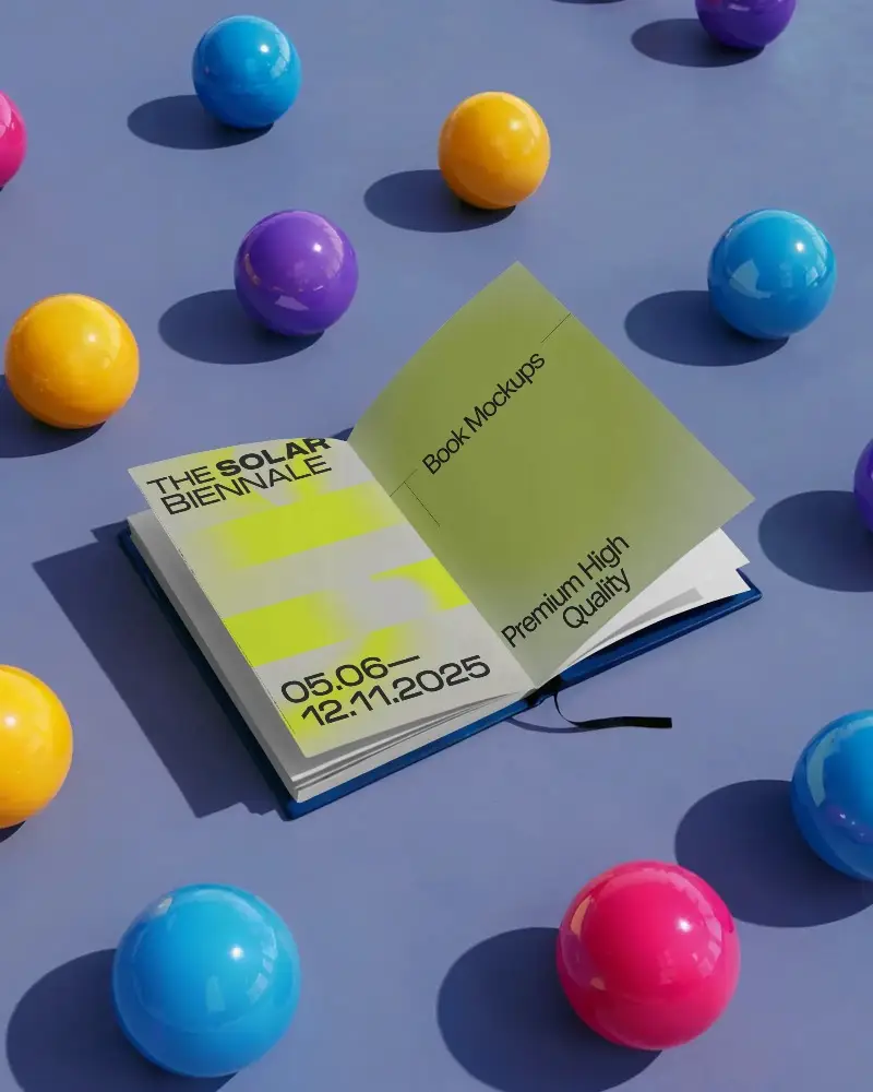 Open Book Mockup On Flat Surface Surrounded By Colorful Spherical Objects For Presentation