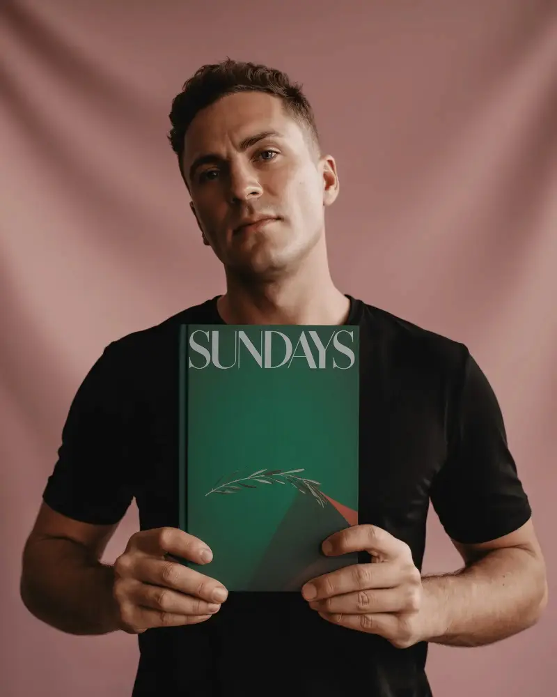 Realistic Book Mockup Male Model Presenting Closed Book For Cover Art Promotion