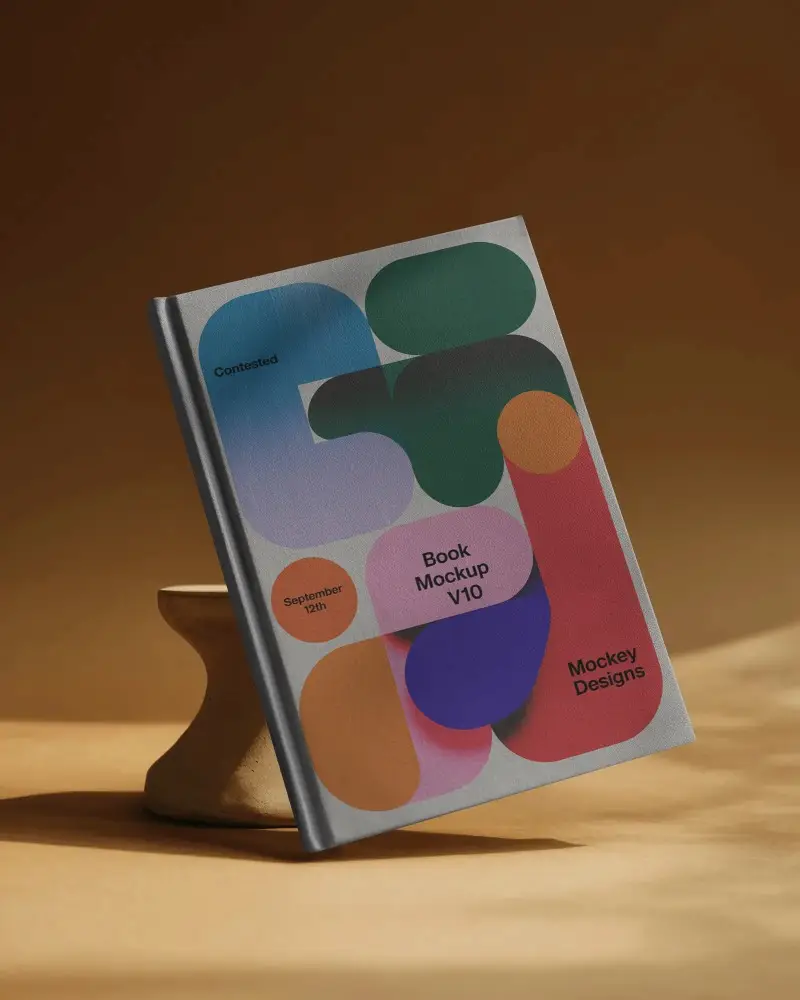 Hardcover Book Mockup Leaning On Sculptural Wood Stand Warm Studio Background