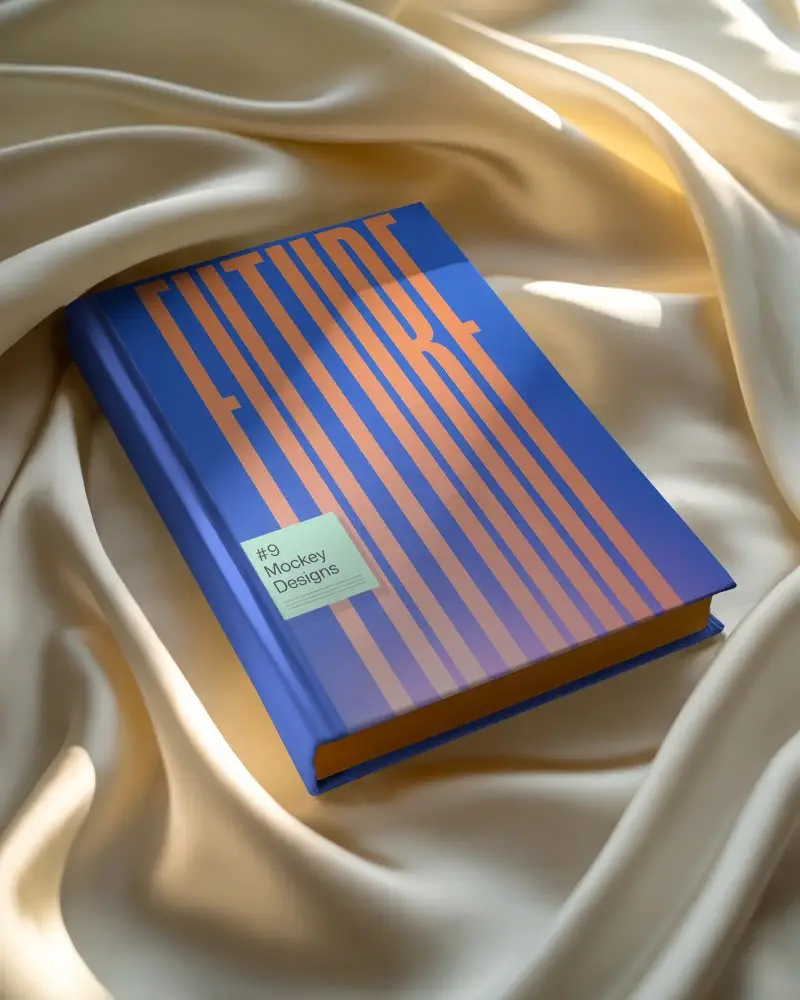 Classic Hardcover Book Mockup On Smooth Fabric Background For Design Presentation