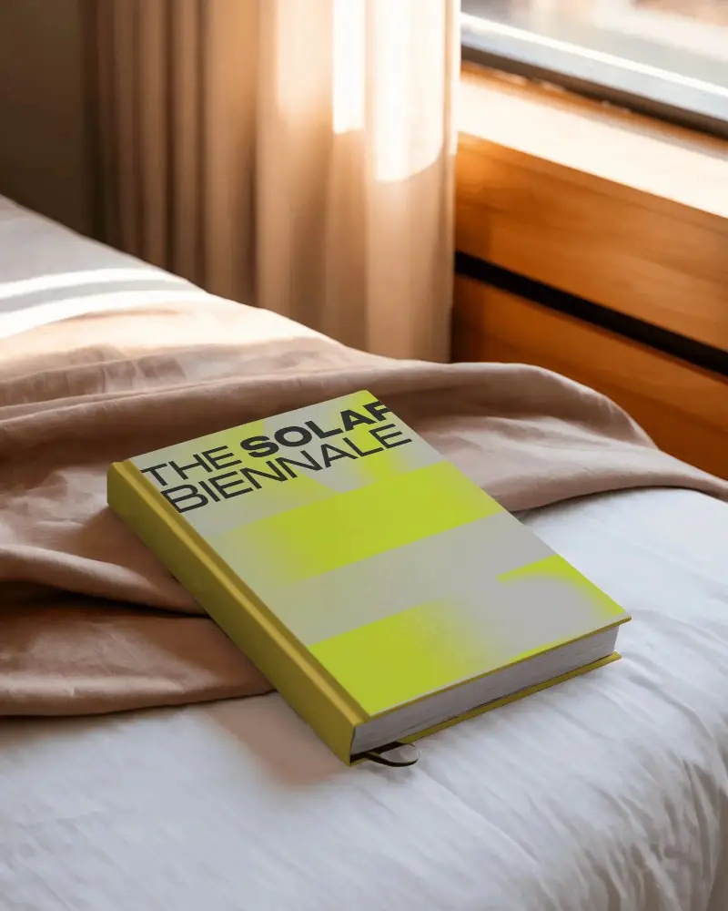 hardcover-book-mockup-placed-on-bed-natural-light-cozy-reading-scene-with-window-curtains