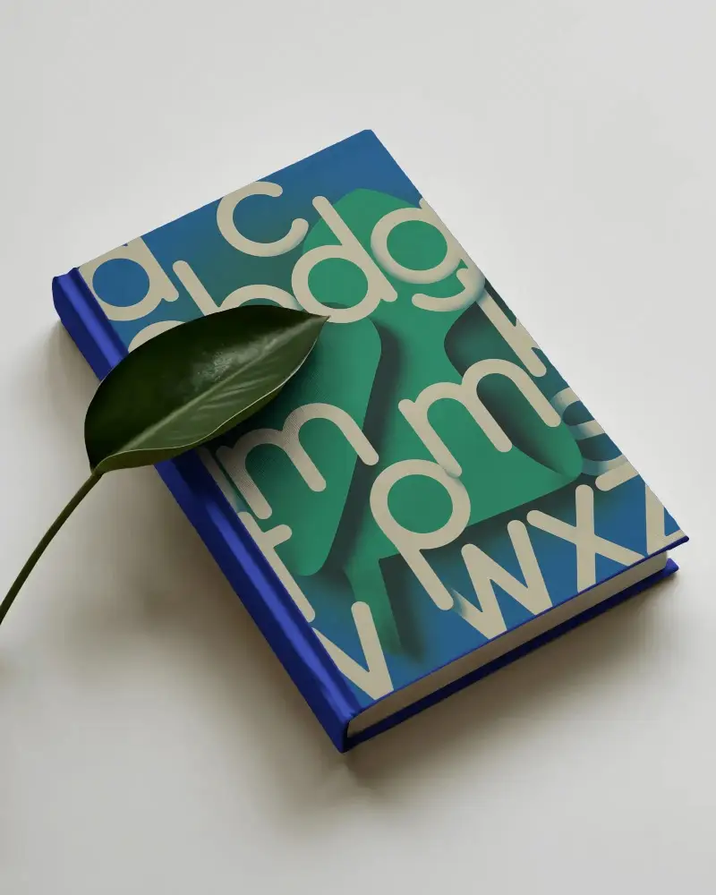 elegant-closed-book-mockup-with-clean-design-and-natural-leaf-accent