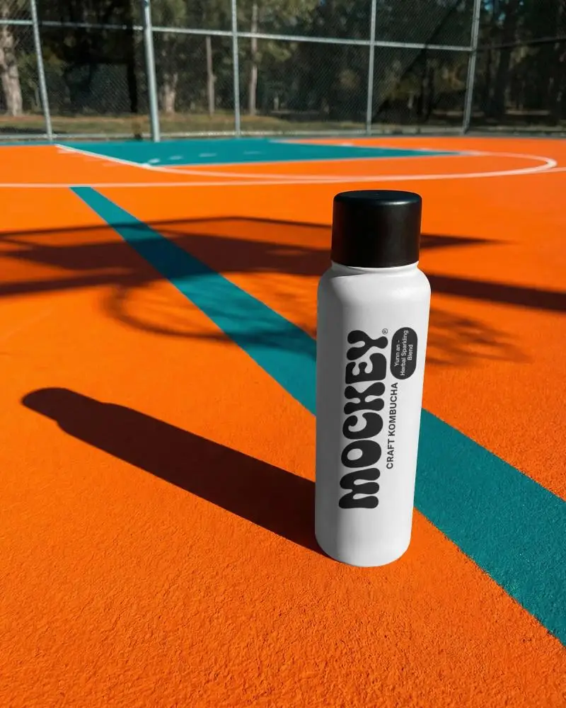 Sport Water Bottle Mockup With Long Shadow On Outdoor Basketball Court Surface Background