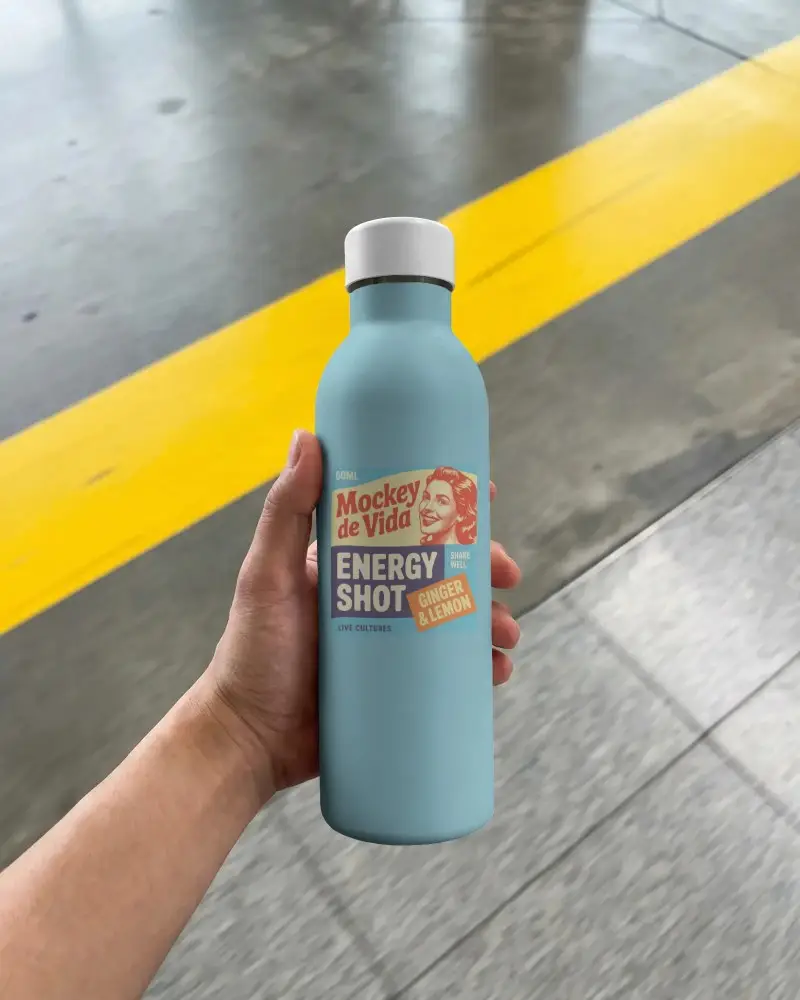 Hand Holding Minimalist Water Bottle Mockup On Concrete Floor With Yellow Line Background