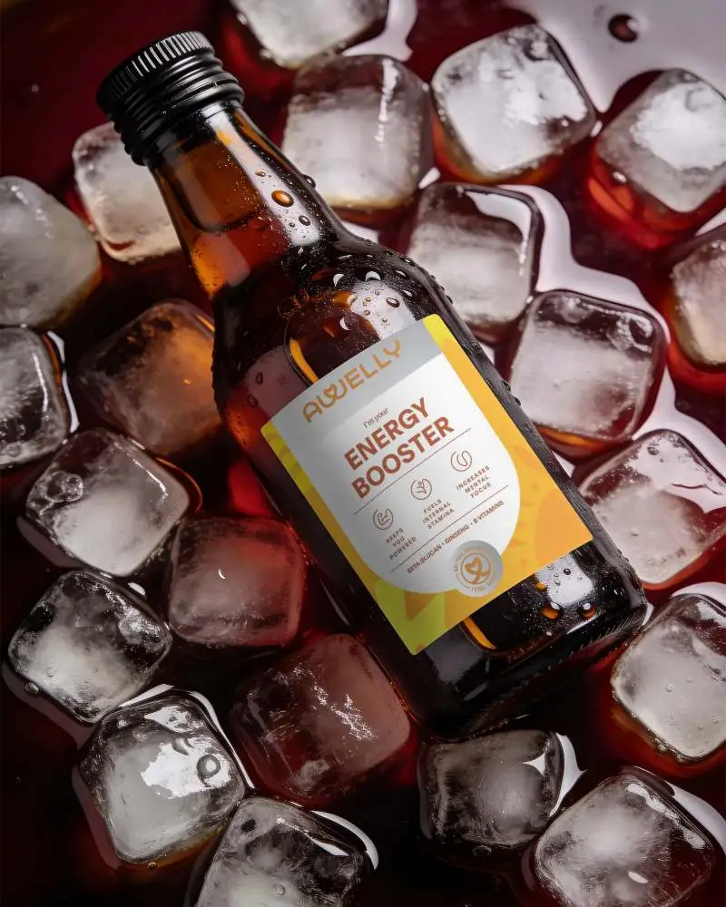 Wet Glass Bottle Mockup Surrounded By Ice Cubes For Drink Packaging Presentation