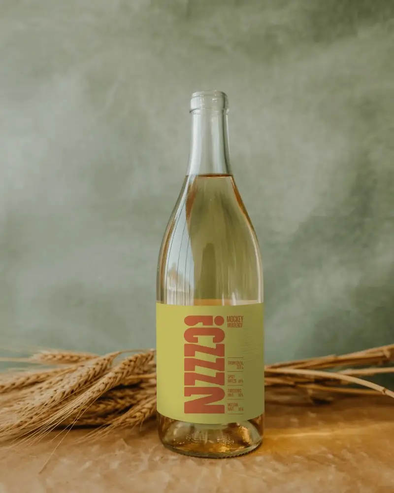 Elegant Clear Glass Bottle Mockup With Simple Black Label On Natural Background Rustic Theme