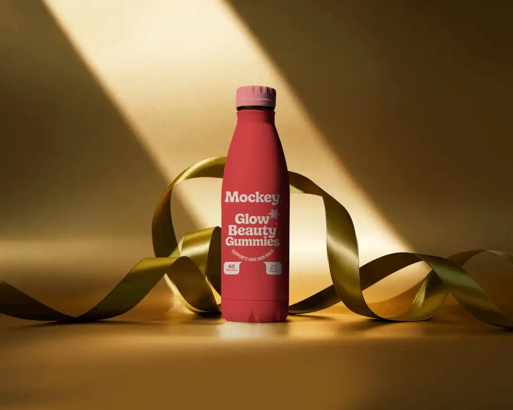 Reusable Travel Bottle Packaging Mockup With Curved Ribbon On Elegant Backdrop