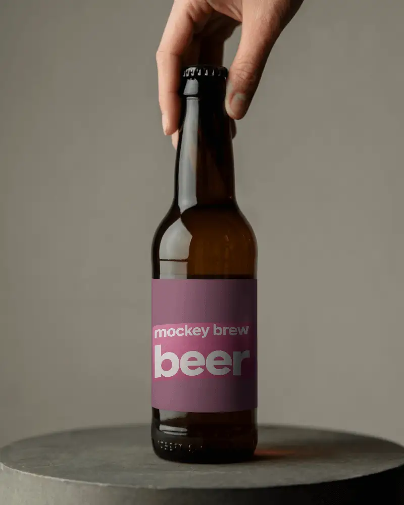 Hand Holding Beer Bottle Mockup With Blank Label For Custom Logo Design Showcase