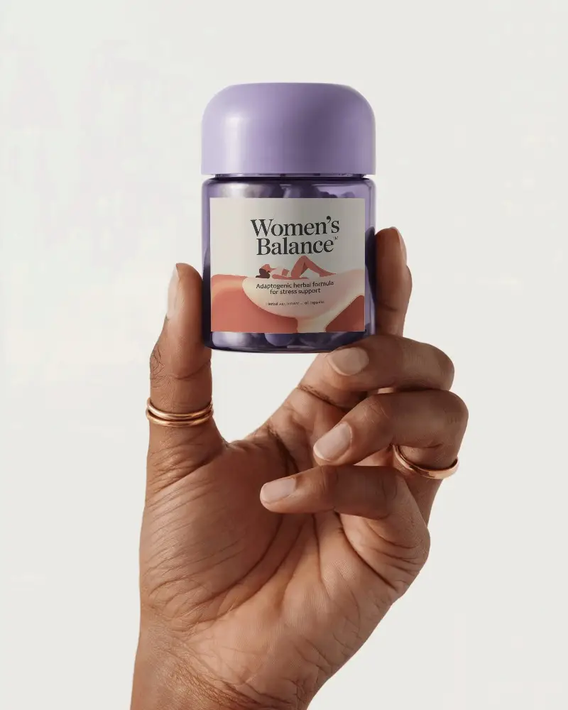 Hand Holding Small Pill Bottle Mockup For Transparent Label Medication Packaging