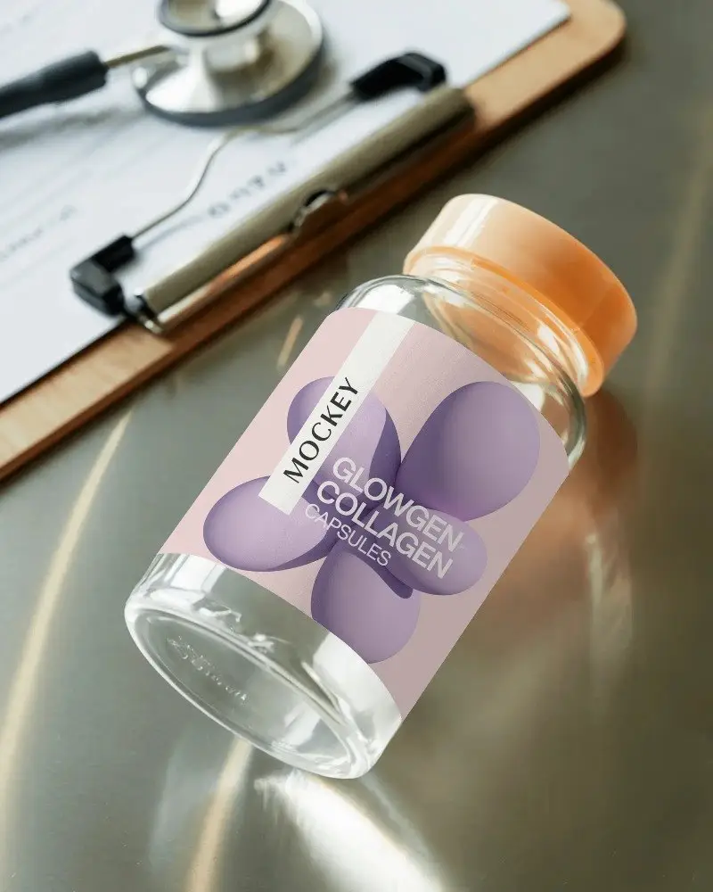 Clear Glass Pharmaceutical Bottle With Blank Label On Reflective Metal Tabletop Mockup