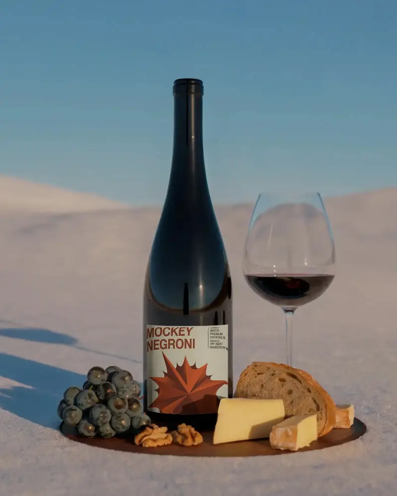 Elegant Wine Bottle Mockup With Grapes Cheese And Bread On Wooden Platter Outdoor Setting