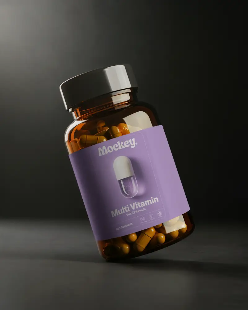 Amber Pill Bottle Mockup Angled On Dark Surface With Studio Lighting