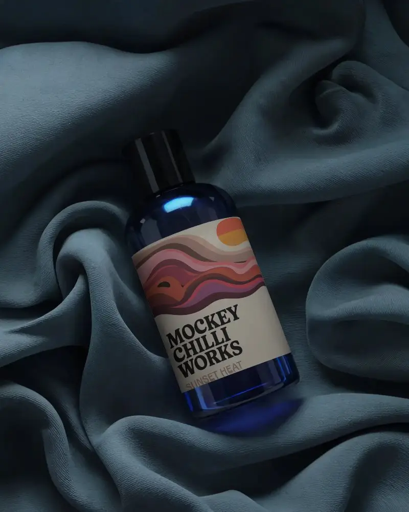 Elegant Beauty Product Bottle Mockup With Customizable Label On Smooth Draped Fabric Background