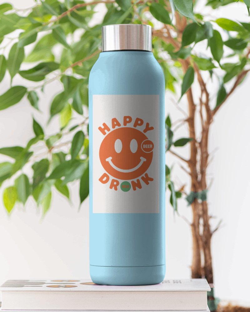 Modern White Bottle Mockup On Books With Greenery In The Background