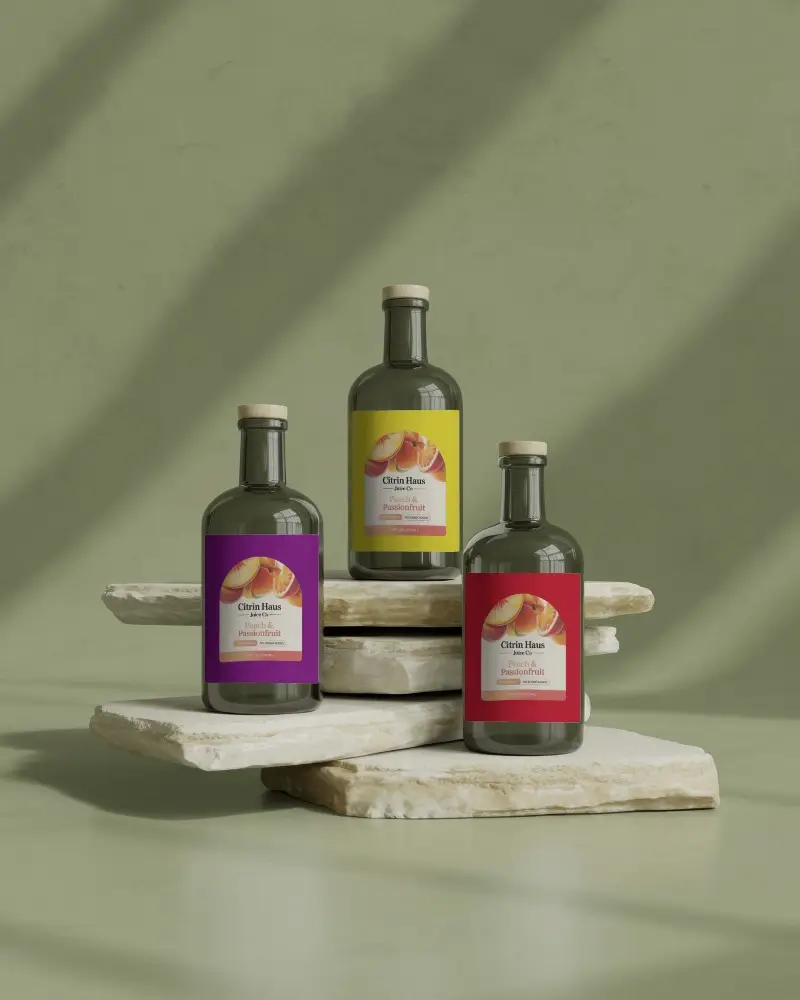 Earthy Glass Bottle Mockup Set On Layered Stone Display With Subtle Sunlight