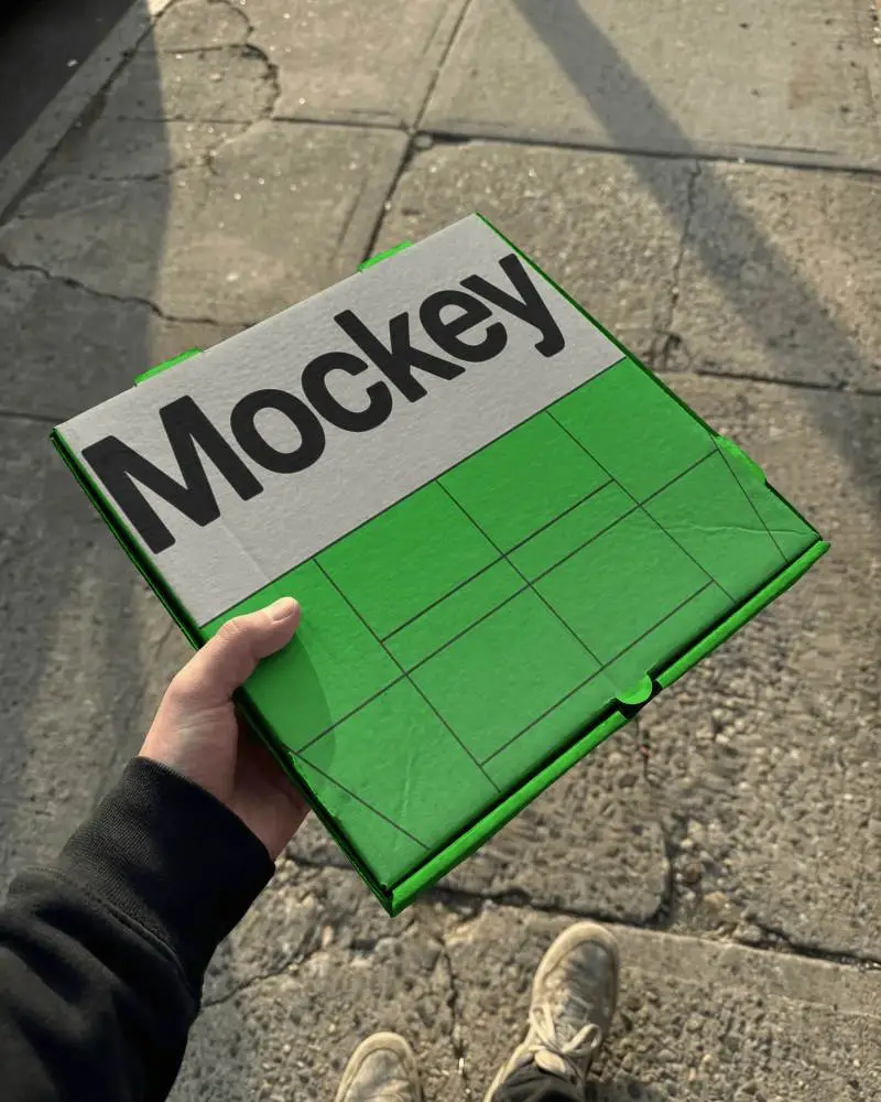 Hand Holding Square Box Foldable Mockup Flat Packaging Box For Easy Storage And Transport
