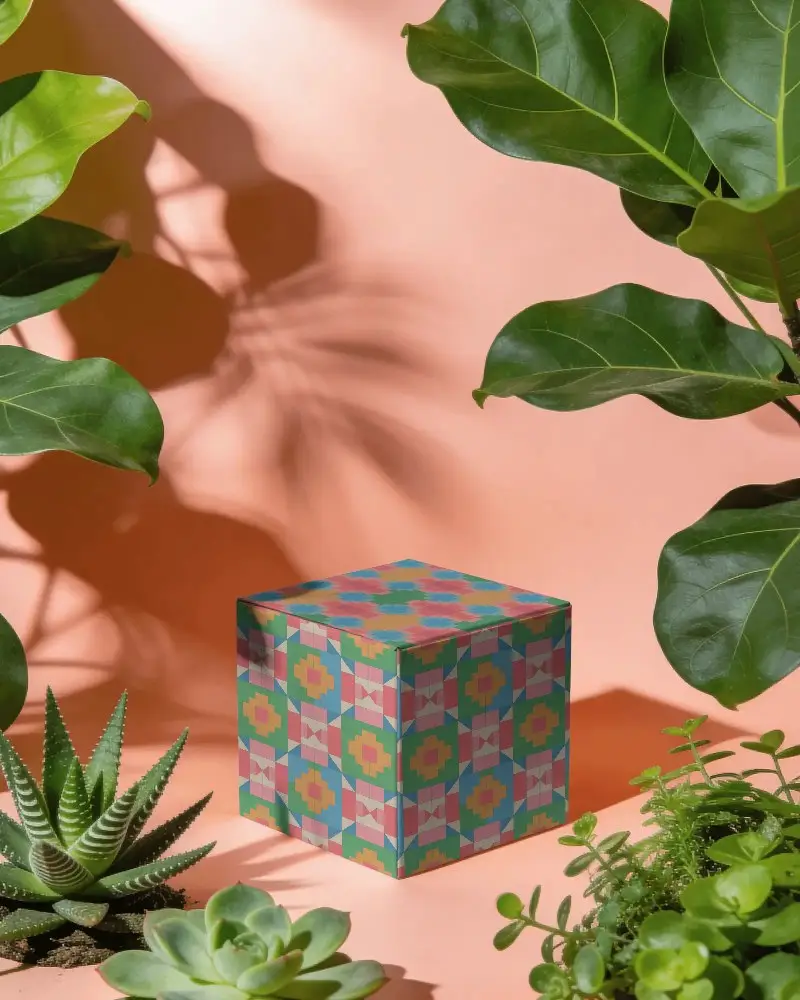 Minimalistic Cube Box Packaging Mockup For Luxury Products Surrounded By Natural Green Plants