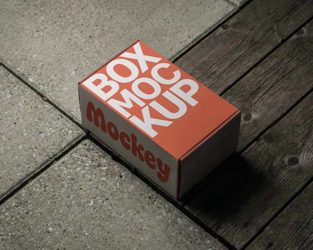 Premium Rectangular Paperboard Gift Box Mockup On Textured Floor For Luxury Packaging Solutions